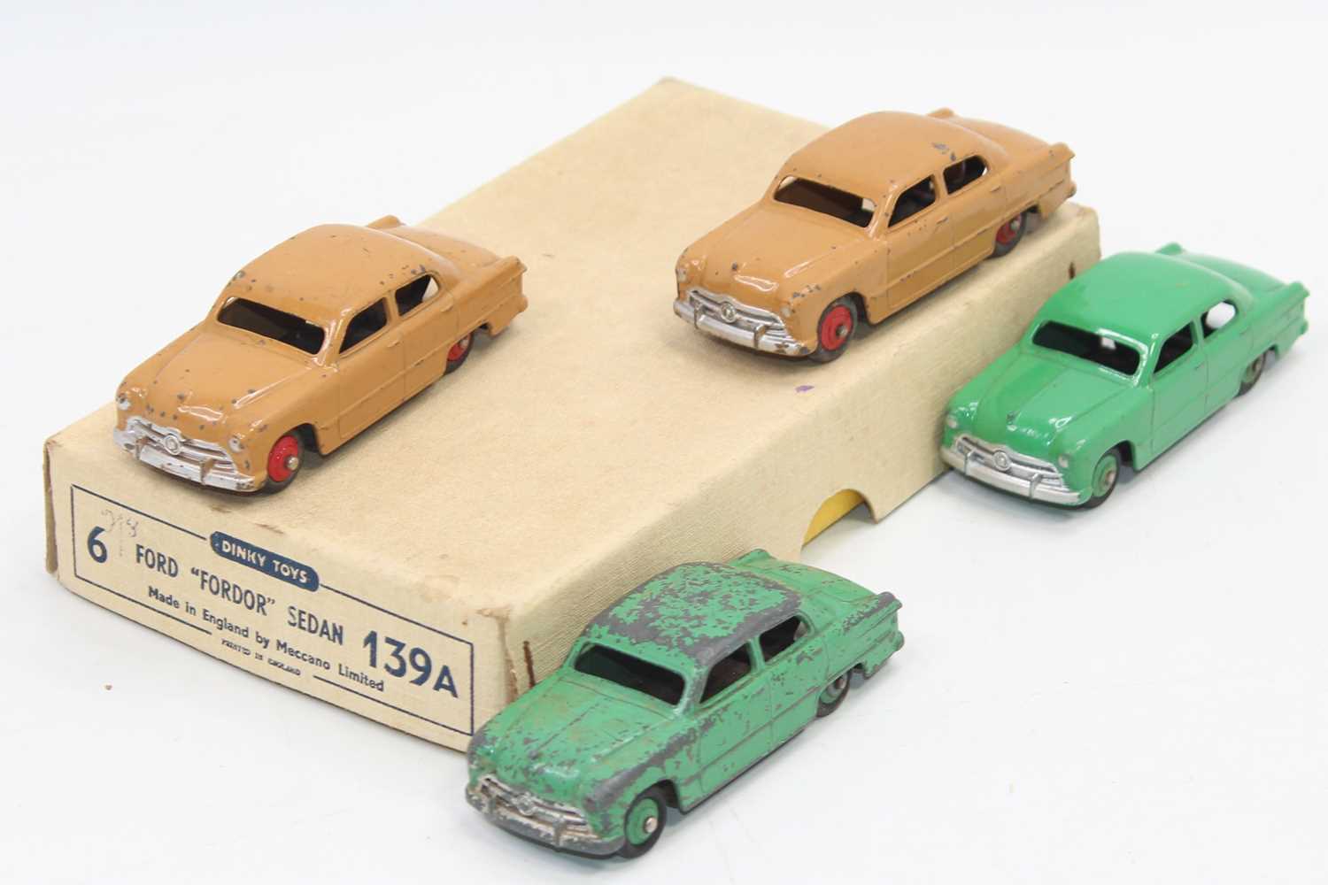 Dinky Toys 139a original Trade box containing 4 Ford "Fordor" Sedan saloon cars, 2 in tan with red