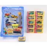 A small tray containing a quantity of unboxed play-worn Matchbox plus 2x boxed 1-75 sf models (12