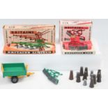 A small group of boxed and unboxed Britains farm machinery as follows: 1x farm tipper trailer,