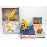 A group of 4 boxed Dinky models as follows: 564 Elevator Loader x2, one is near mint the other is