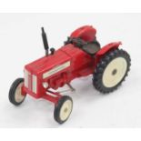 A very rare Tekno No.465 International McCormick tractor, red body with white hubs and black