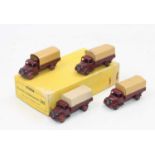 Dinky Toys 30s original Trade box containing 4 Austin Wagons, in maroon with tan, tinplate tilts,