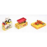A group of 3 boxed Dinky Toys as follows: 305 David Brown Tractor and a 323 Triple Gang Mower,