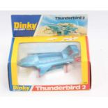 A boxed Dinky Toys 106 Thunderbird 2 in window style box, model in blue with black base 2 small