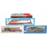 Three HO American diesel locos and one non-powered trailer: PMI 6600 Santa Fe (E-BE) with unboxed