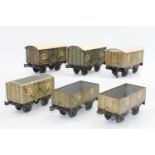A small tray containing 6x 1920s Bing wagons including SR goods van Open wagon and wooden goods van,