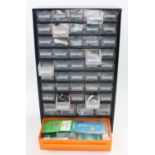 Set of 40 plastic drawers in metal frame, containing 0 gauge spares and kit parts, very clean and