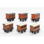 A small tray containing 6x Bing small coaches including 2x GNR 1st/3rd and a luggage/brake, and 2x