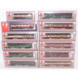 Twelve assorted Lima passenger coaches; six maroon & cream, five BR(S) green and one maroon.