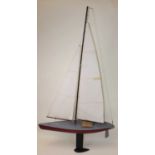 Wooden home made model of a Sailing Yacht, with weight keel and Nylet sails, hand painted in red,