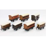 A small tray containing 7x 1920s Bing 4 wheel coaches including 2x LNER coaches, LNER passenger