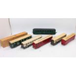 Six JEP bogie coaches: 2 x brown & cream; one duo tone green baggage car; one dark green – appears a