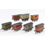 A small tray containing 7x assorted Jep items including 4x coaches, passenger brake van, cattle