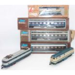 Lima O gauge continental locos and coaches. Locos amended to 3-rail power collection. Two DB 218-