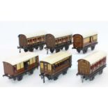 A small tray containing 6x 1920s Bing 4 wheel coaches including 2x GWR coaches, 2x GWR passenger