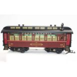 Three Bachmann Spectrum G scale coaches Pennsylvania, deep maroon and black, with balcony ends.