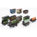 A small tray containing 11x assorted 4 wheel German items including green c/w 0-4-0 loco with