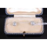 A cased pair of Art Deco 18ct white gold, mother of pearl and diamond point set collar studs, 2.6g