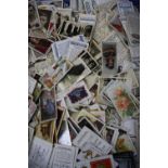 A large collection of loose cigarette and collectors cards, to include Will's and Players etc
