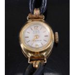 An Emka of Geneva ladies 14ct gold cased mechanical wrist watch having signed silvered dial, case