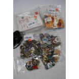 A box of miscellaneous items to include various football and speedway badges, enamel badges, olympic