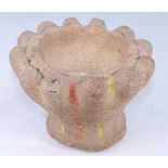 A carved stone mortar, the deep circular bowl with twelve fluted sections to the exterior, the