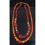 A graduated amber barrel bead single string necklace, the beads of various colour, 20.4g, 48cm;