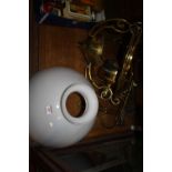 A Victorian brass hanging lantern with milk glass shade