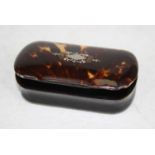 A 19th century horn pocket snuff box of shaped rectangular form, the hinged tortoiseshell lid with