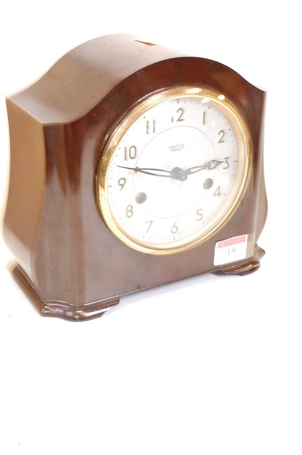 A 1930s bakelite cased eight-day mantel clock, the silvered dial showing Arabic numerals and - Image 8 of 10