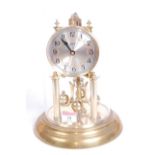 A 20th century Schatz brass anniversary clock, the silvered dial showing Arabic numerals, h.30cm,