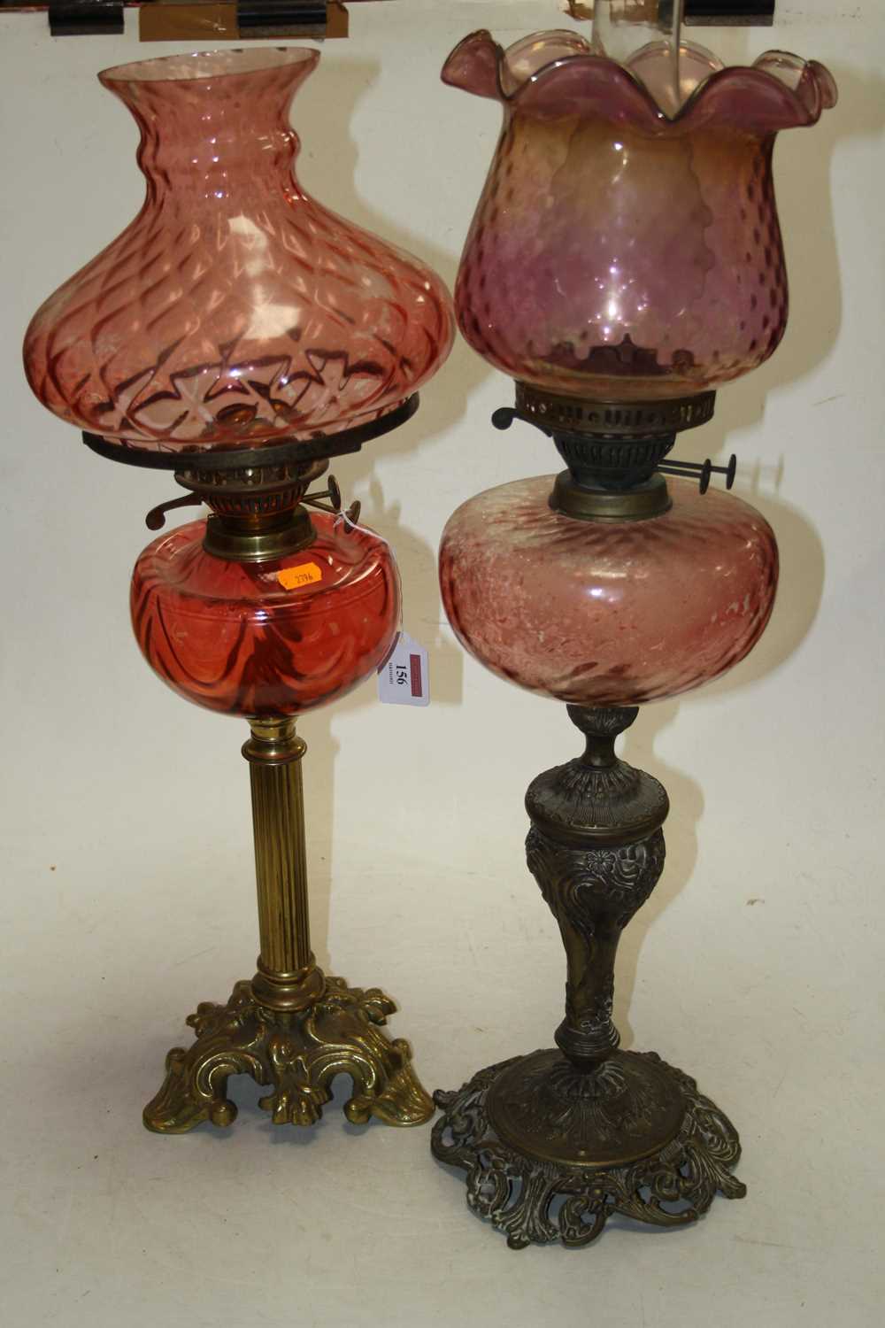 A late 19th century brass and rose-tinted glass oil lamp, h.64cm; together with another similar (2) - Image 4 of 4
