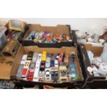 Eight boxes containing a collection of diecast model vehicles and other toys, to include