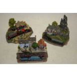A Danbury Mint Jane Heart Steaming West resin model, boxed; together with two other similar, the
