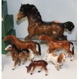 A Beswick Cantering Shire, model No. 975, brown gloss finish, together with a Beswick Cocker