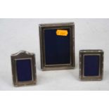 A modern silver-clad easel photograph frame, of rectangular form, having beaded border, 10.5 x