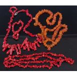 An orange amber necklace; together with two dyed coral long necklaces (2)
