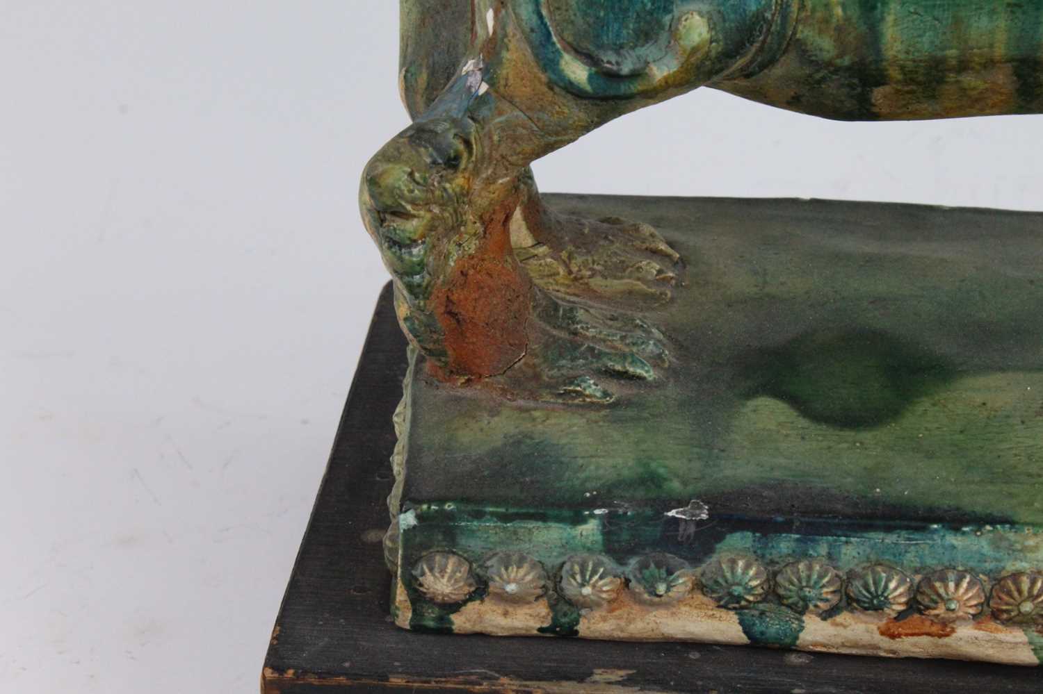 A Chinese green glazed pottery figure of a Fu Lion, modelled in proud standing pose, mounted on a - Image 10 of 12