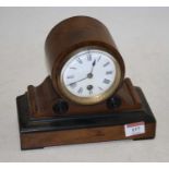 A Victorian walnut cased mantel clock, the enamel dial showing Roman numerals 18cm high