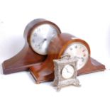 An early 20th century walnut cased Napoleon's hat eight-day mantel clock, with chimes, the