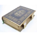 A Victorian brass and leather bound family bible, the Old and New Testaments, with commentaries of