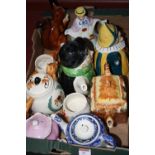 A box containing a collection of various novelty teapots to include Tony Wood and Price Kensington