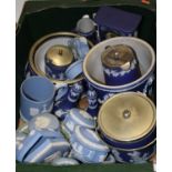 A box containing a collection of Wedgwood blue jasper ware to include a mantel clock, jardiniere,