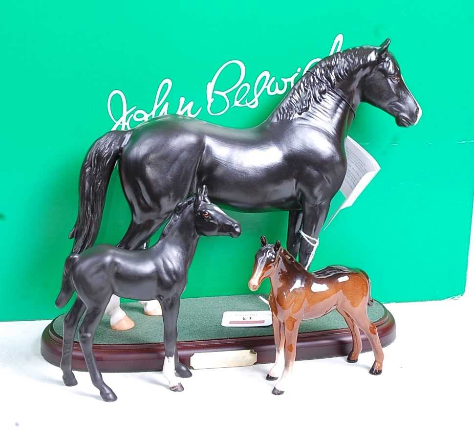 A John Beswick of Royal Doulton model of a Welsh Cob Stallion, mounted on a plinth, h.24cm, boxed;