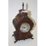 An early 20th century French style walnut and gilt metal mounted eight-day balloon mantel clock,