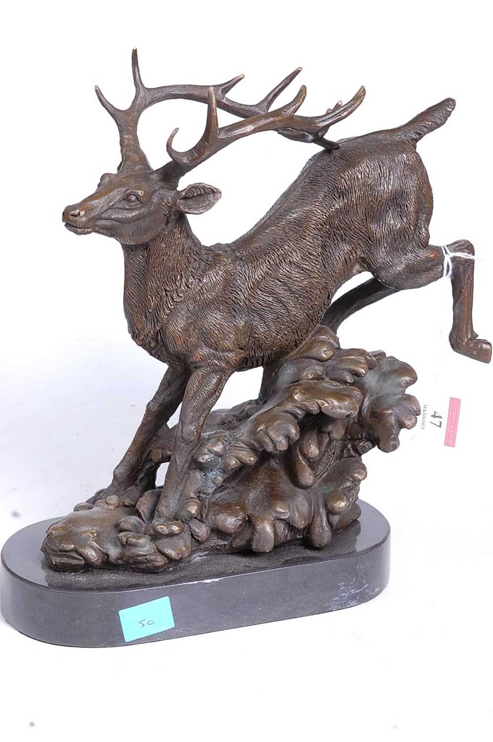 A bronze model of a running stag, upon a naturalistic base, mounted upon a slate plinth, h. - Image 2 of 2