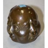 A reproduction bronzed four faced buddha