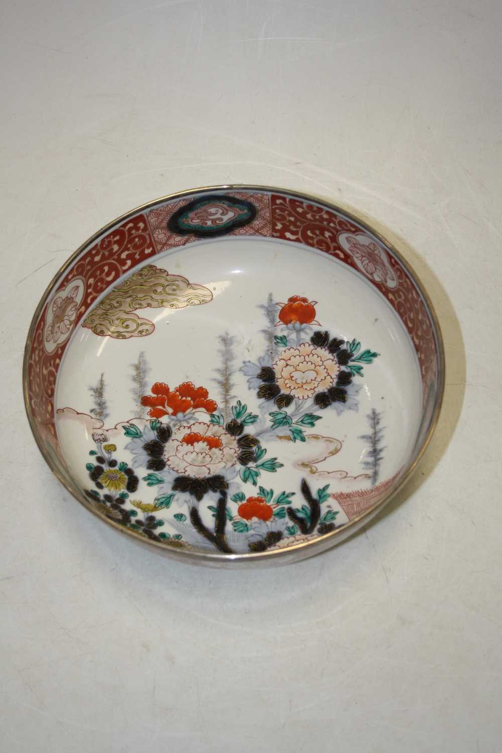 A 19th century bowl, the centre decorated with flowers, in shades of iron red, blue and turquoise, - Image 5 of 5