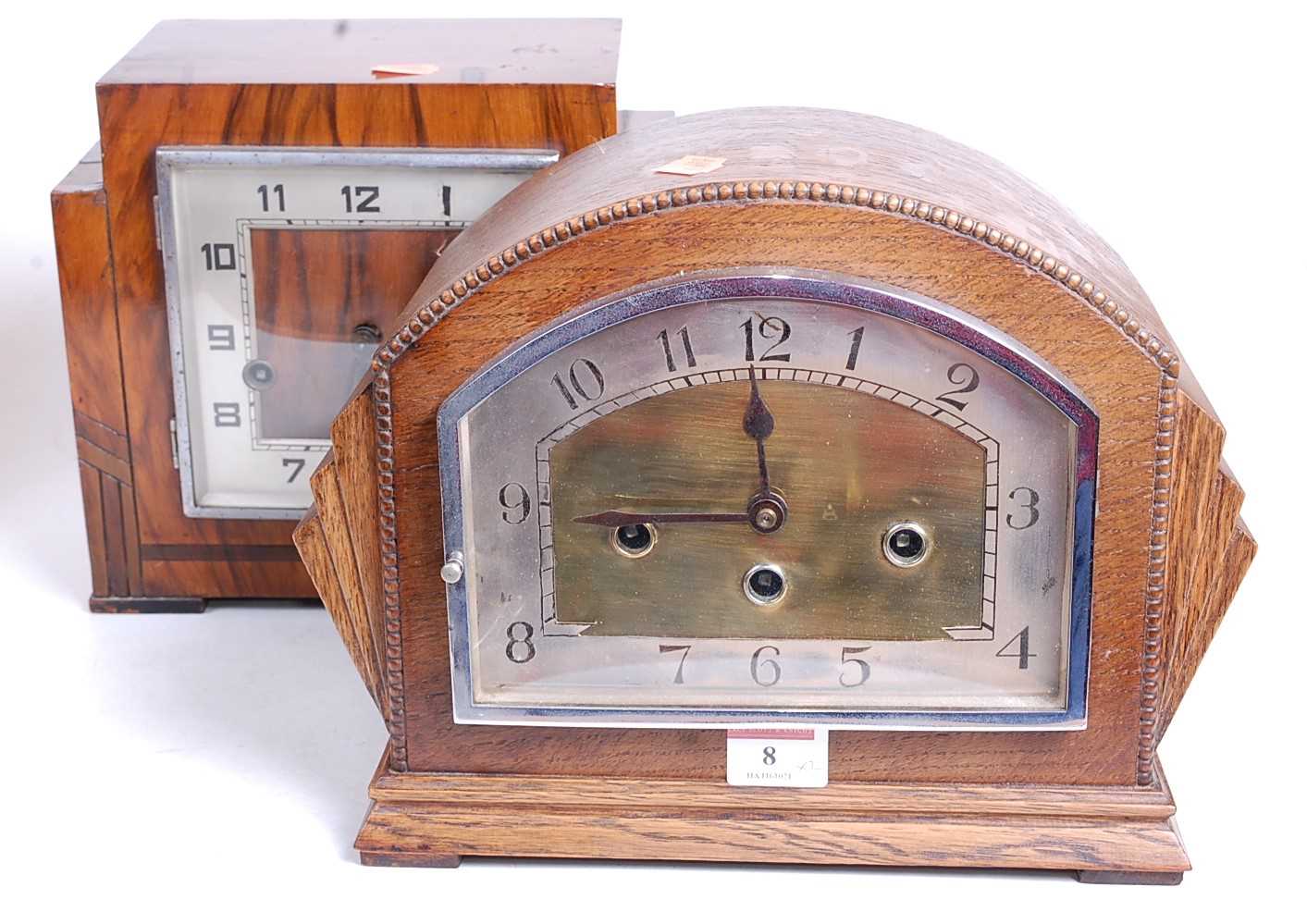 A 1930s oak cased mantel clock, the eight day movement with chimes, the silvered chapter ring