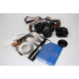 An Olympus OM10 camera, with Olympus T20 electric flash and instructions manualsCondition report: